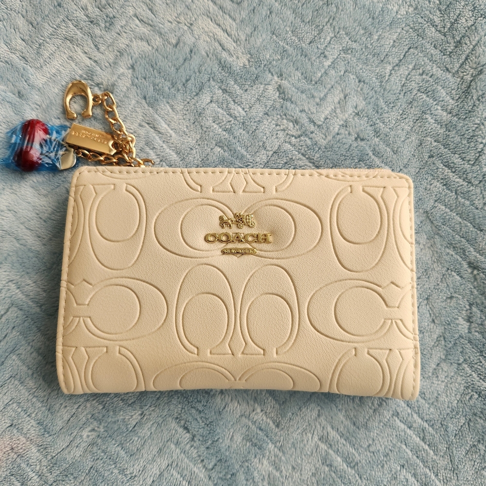 Coach Ivory Embossed Pouch with Gold Accents